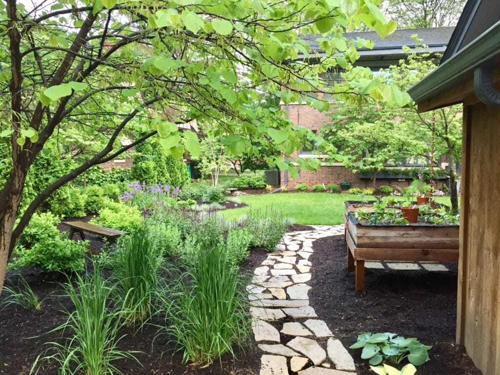 flagstone walk through an urban garden 2023 11 27 05 18 09 utc