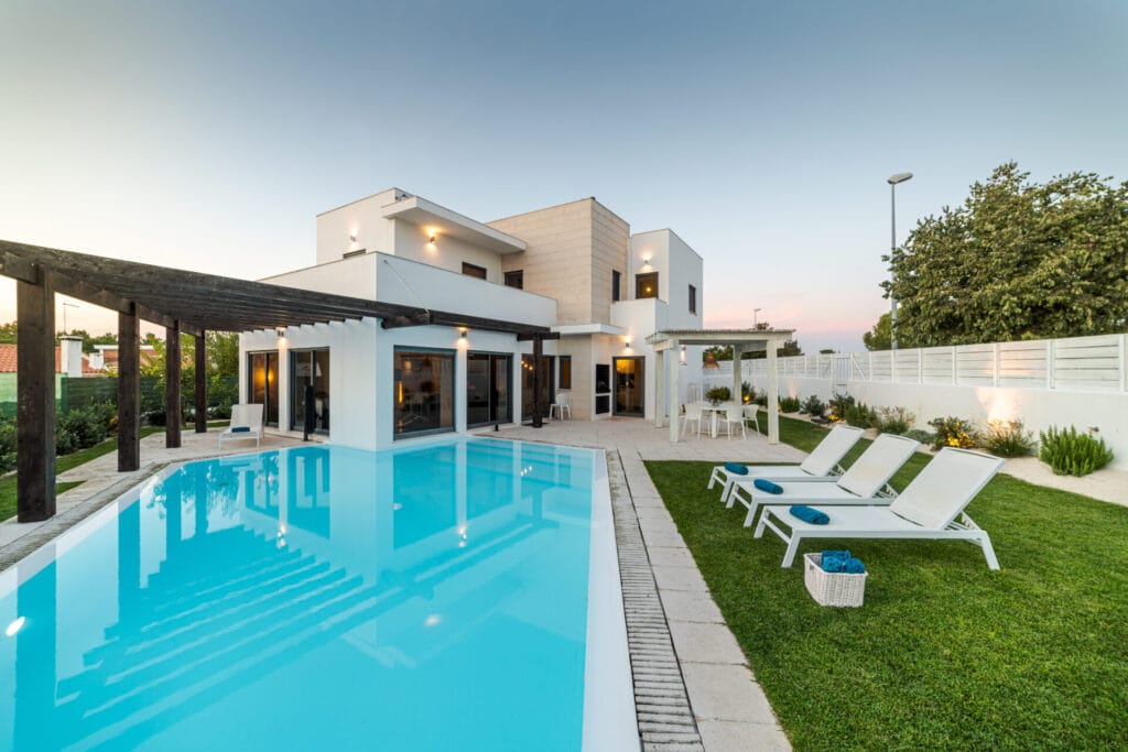 Modern house with garden swimming pool and wooden pergula