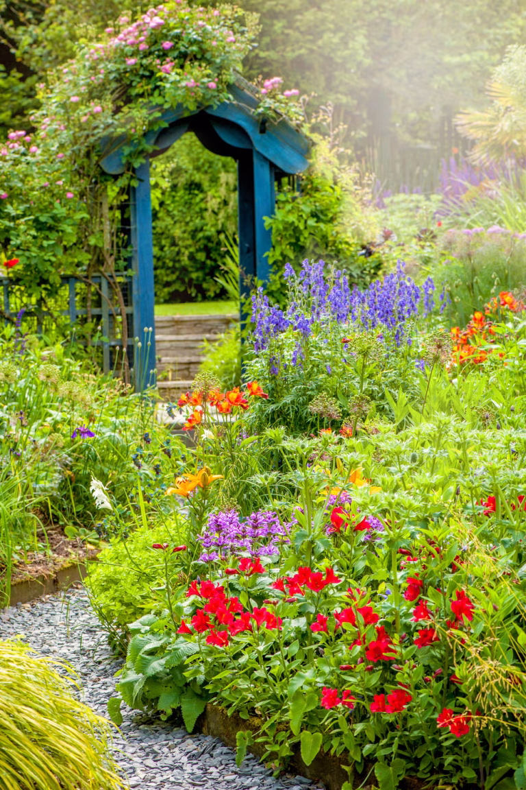 beautiful english cottage summer garden with blue royalty free image 1643818268