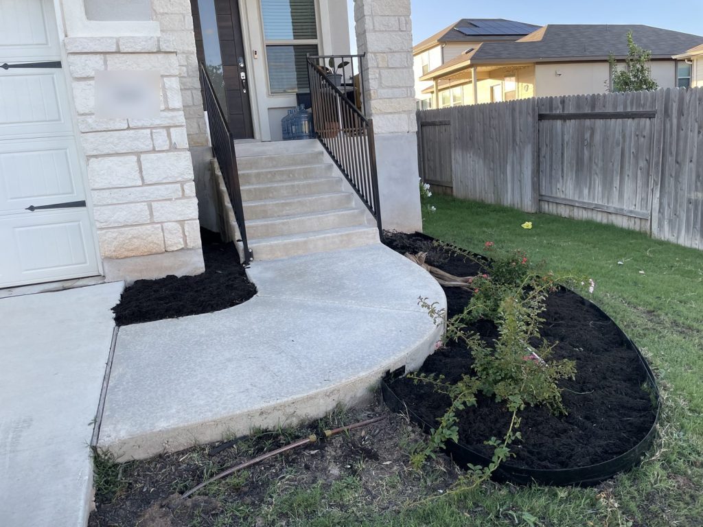 Recent Landscaping Projects In Austin, Tx 12 new planting bed with steel edging and black mulch by the front steps