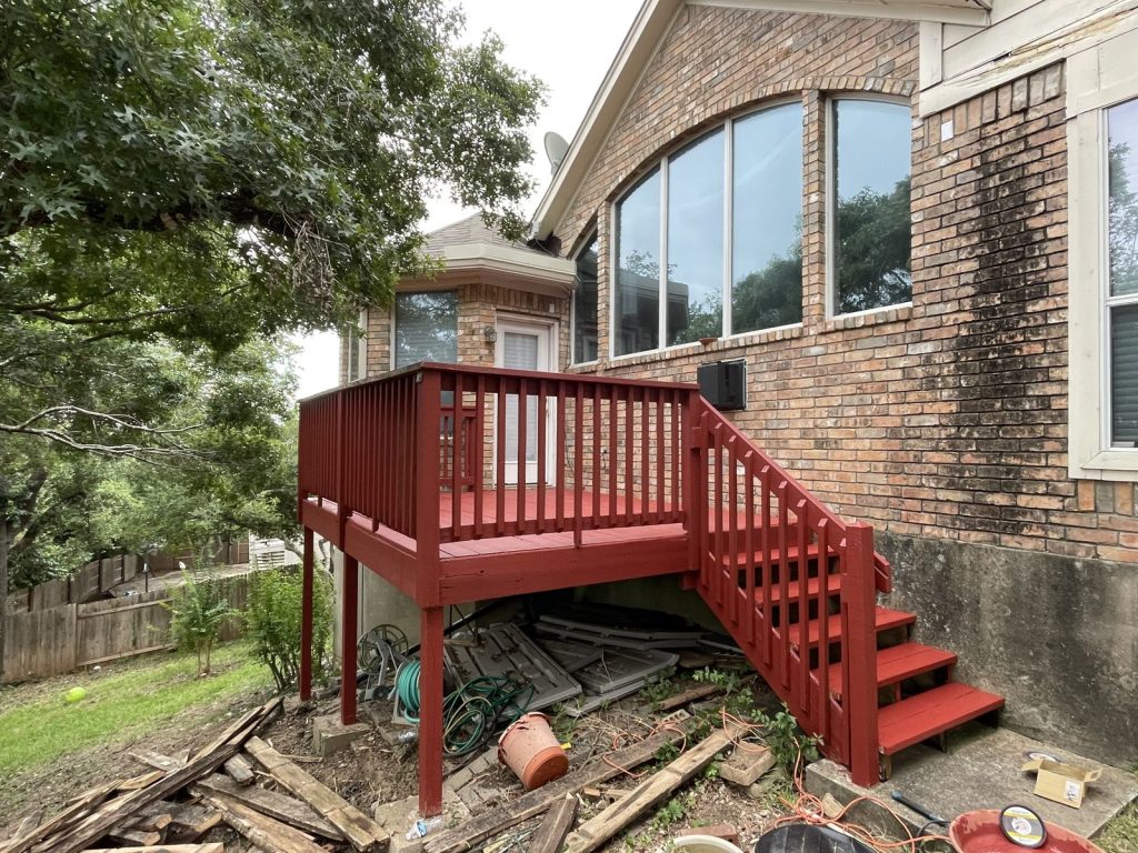 Recent Landscaping Projects In Austin, Tx 3 restored deck with red stained floor, railing and stairs, austin tx