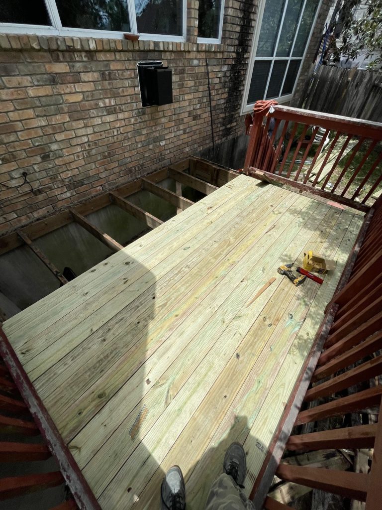 Recent Landscaping Projects In Austin, Tx 2 new pressure-treated deck boards installed on an austin-area deck