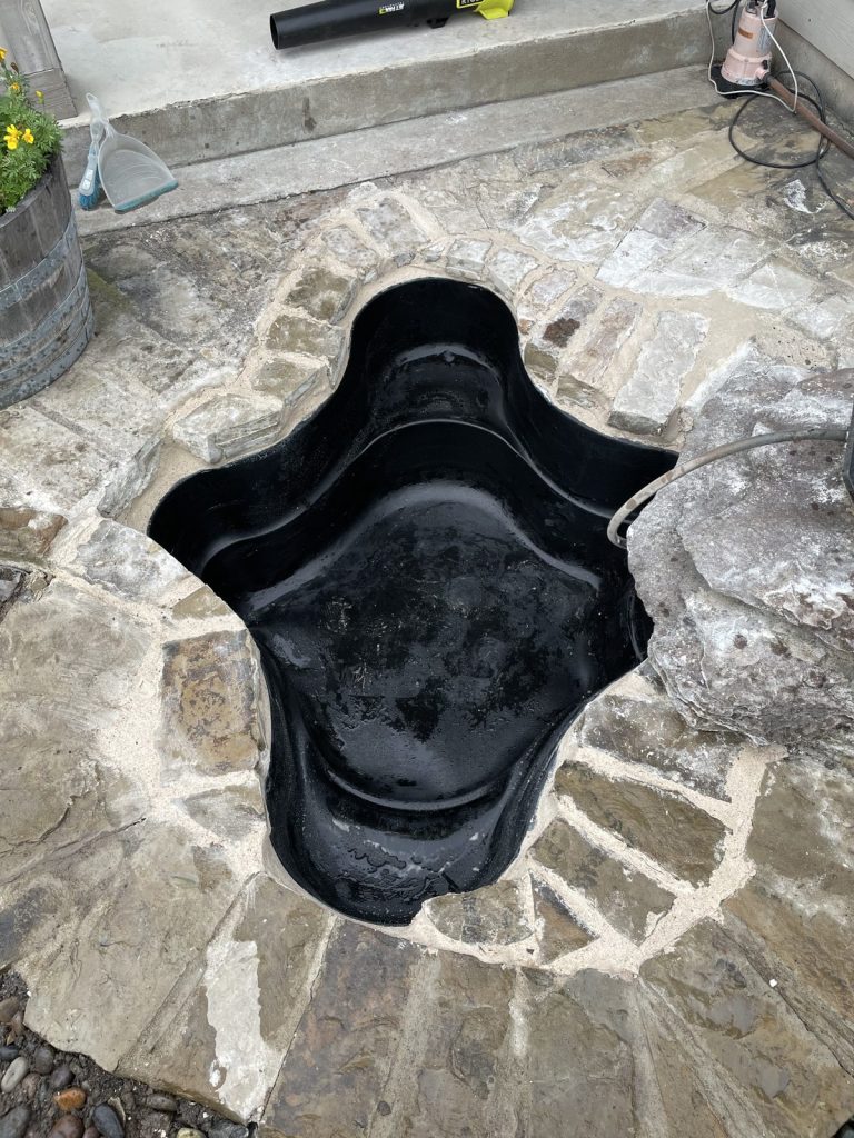 Recent Landscaping Projects In Austin, Tx 6 backyard pond installed with a flagstone surround, austin area
