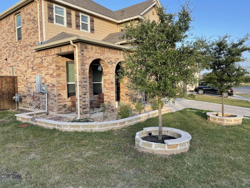 Recent Landscaping Projects In Austin, Tx 13 limestone tree rings and bed border in a front yard, austin area