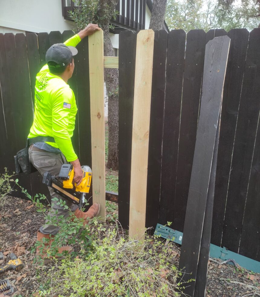 fence repair process by one worker of innovation grounds in Austin Texas.